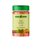 Kryddburk med krossad chili, grön lock, vacker etikett och orientaliska kryddor visible